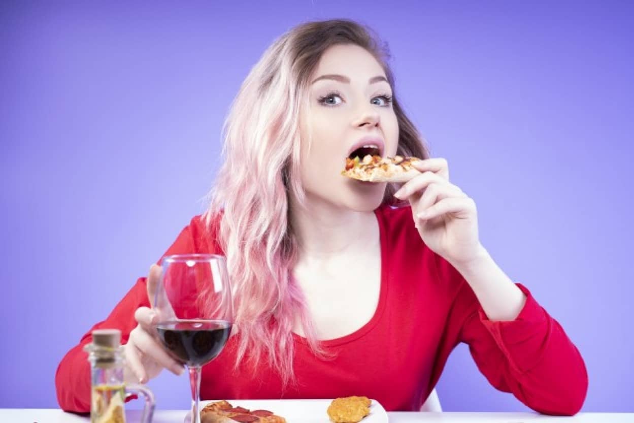 young-woman-red-blouse-eats-pizza-holds-glass-red-wine_e