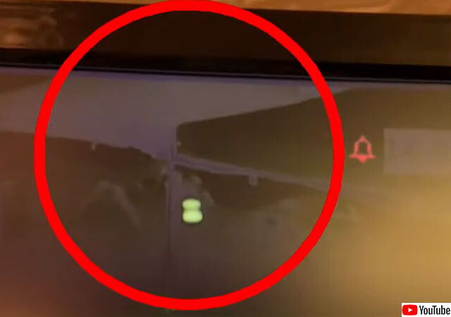 イギリスのパブの監視カメラがとらえた緑色の発光物体を持ち運びながらうろついている幽霊らしき人影