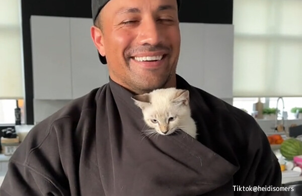 ハリケーンからカップルに救出された子猫、ヒゲメンマッチョと相思相愛に