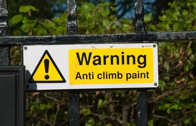 Anti_climb_paint_sign_e