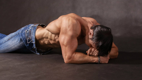 tired-bodybuilder-lying-floor