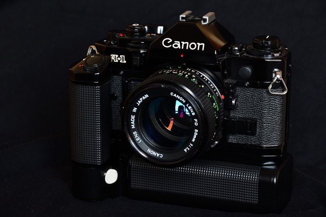 Canon A-1 w/50mm f/1.4, Motor Drive/Battery Pack, & Data