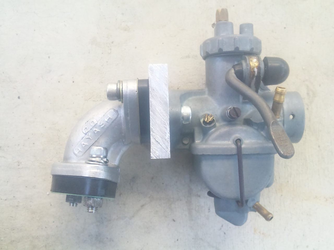 早矢仕斜めマウントキャブ用マニにC200純正キャブまたはPC20を