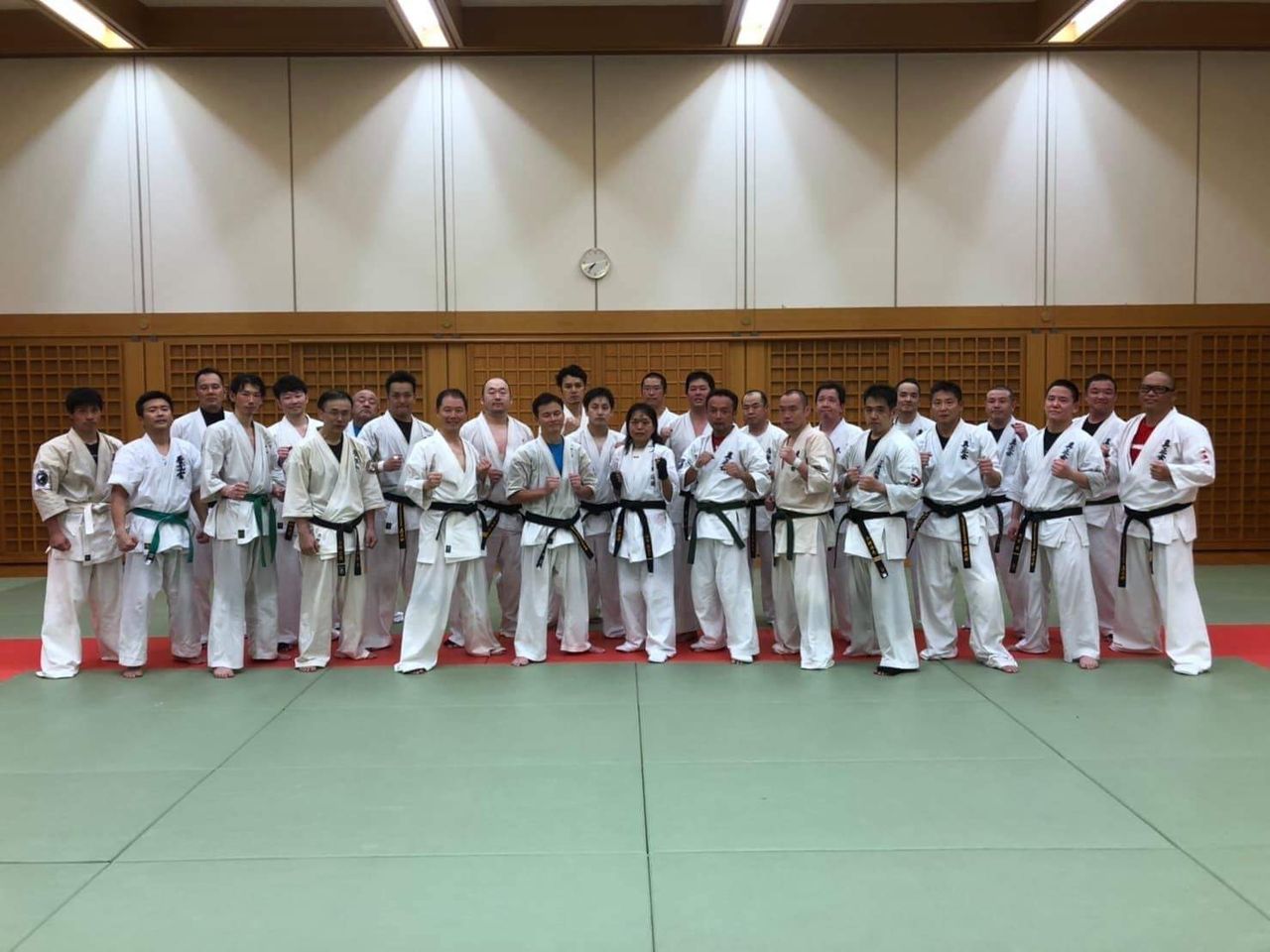 Japanese karate association event banner showing dojo information and tournament-related text