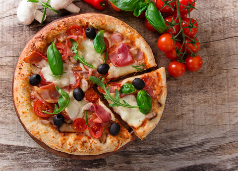 bigstock-Delicious-italian-pizza-served-50150264