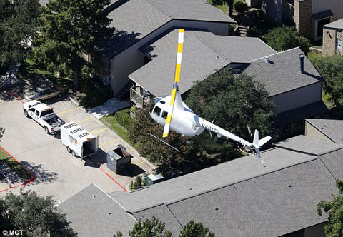 1413404344019_wps_35_A_helicopter_hovers_as_th