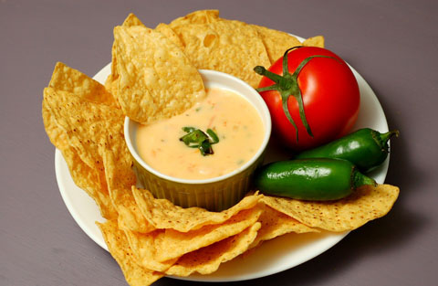 roasted+chile+con+queso+with+chip+in+dip1