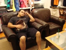 holding-a-purse-on-the-man-couch