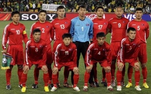 Korea20DPR-10-LEGEA-away-kit-red-red-red-pose[1]