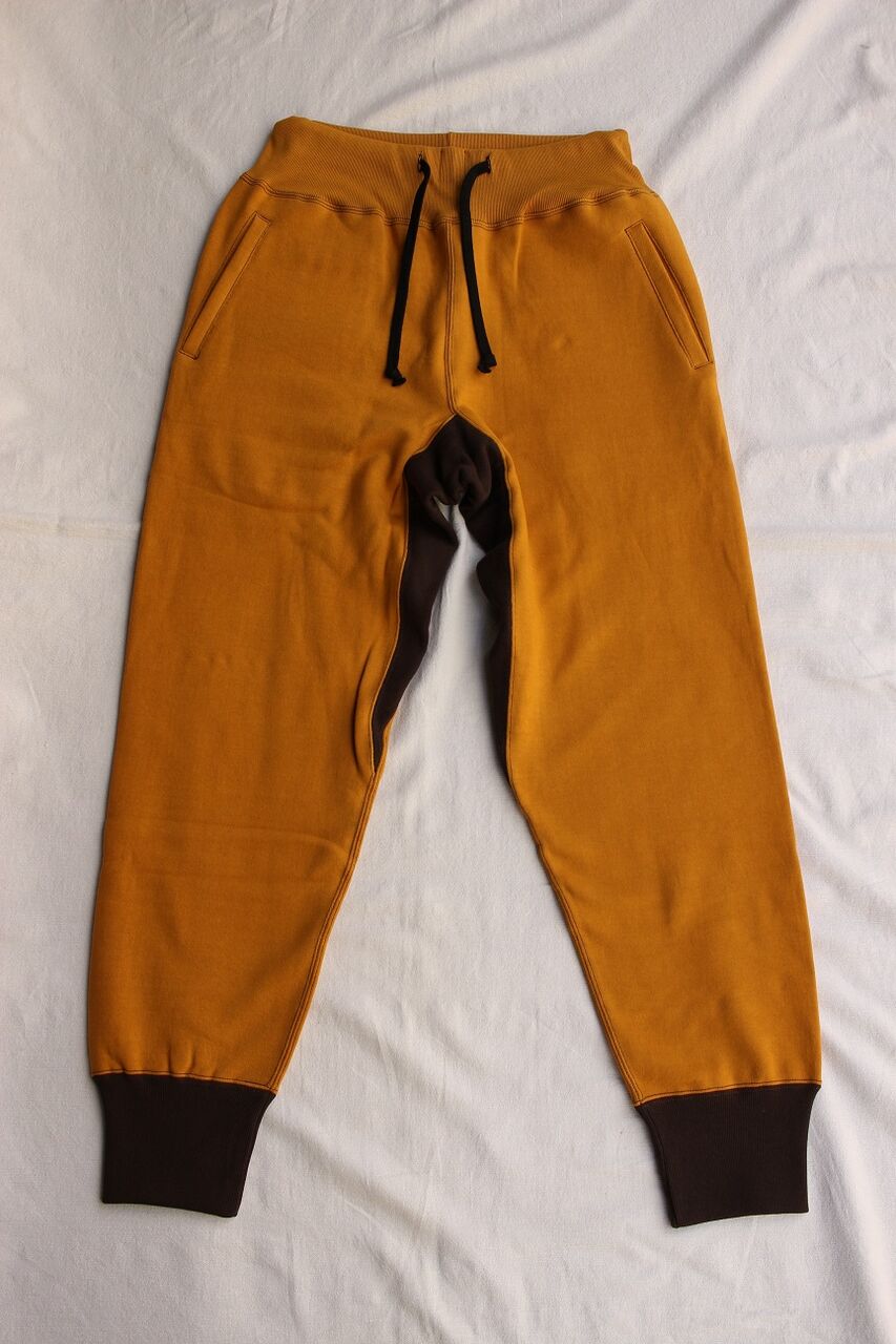 FREEWHEELERS / SWEAT PANTS (OLD GOLD × SOOT BLACK) : McFly