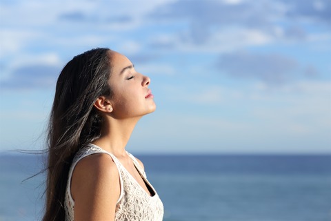 featurepics-Woman-Breathing-Fresh-Air-143858-2823541