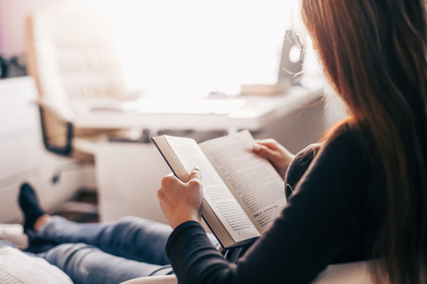 girl-reading-a-book-at-home-picjumbo-com