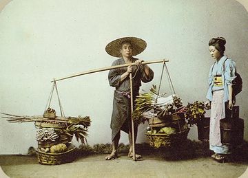 天秤棒で?