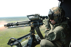 1200px-GAU-17_machine_gun_fired_from_UH-1N_Huey_in_2006