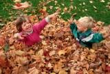 kids-playing-with-autumn-leaves small