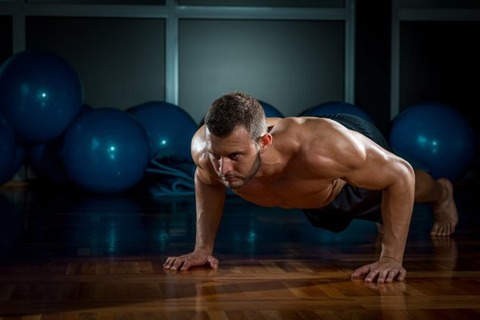 depositphotos_69443579-stock-photo-man-doing-push-ups-in
