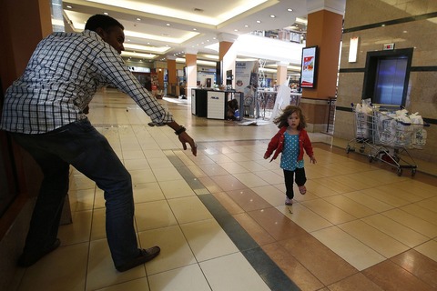 A-child-runs-to-safety-2290724