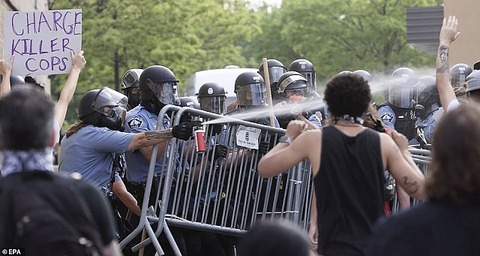 28909232-8363407-Police_spray_pepper_spray_into_c