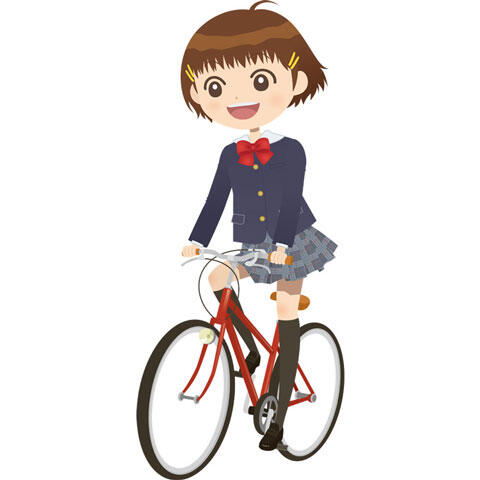 自転車に乗って通学する女子学生