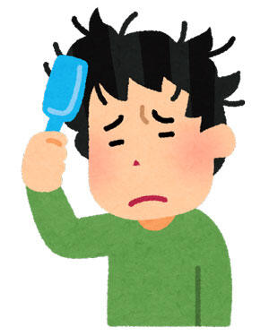 ブラシで髪をとかしている男性