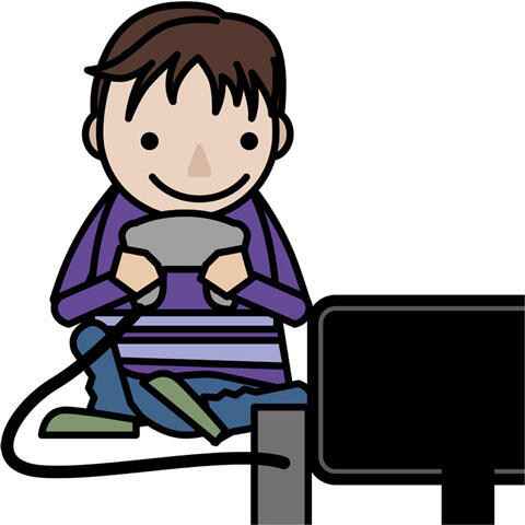 テレビゲームで遊んでいる少年