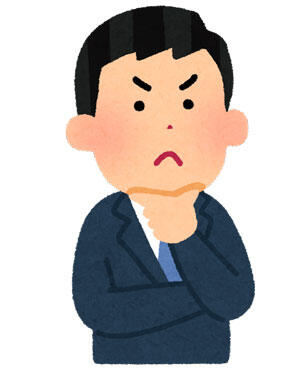 考え事をしている男性会社員