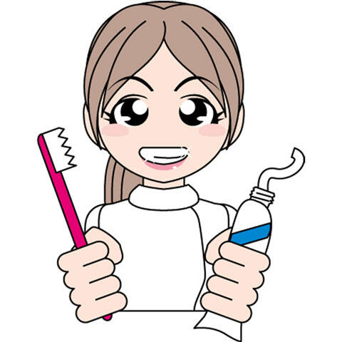 歯ブラシと歯磨き粉を持つ歯科衛生士