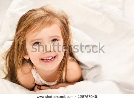 stock-photo-adorable-little-girl-awaked-up-in-her-bed-128767049