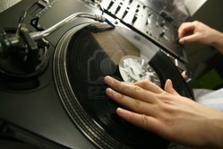 2475357-scratch-battle-of-dj-playing-on-his-vinyls-hand-on
