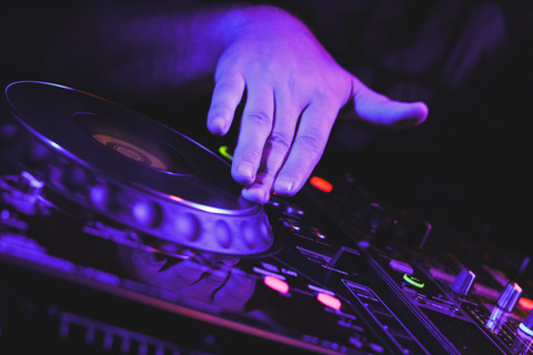 djs-scratching-on-cd-players-hand-close-up-picjumbo-com