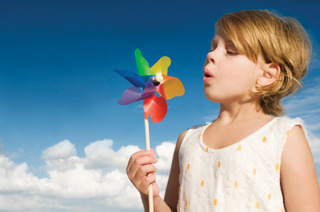 girl-blowing-pinwheel
