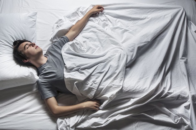 man-asleep-in-a-bed-royalty-free-image-1751017306