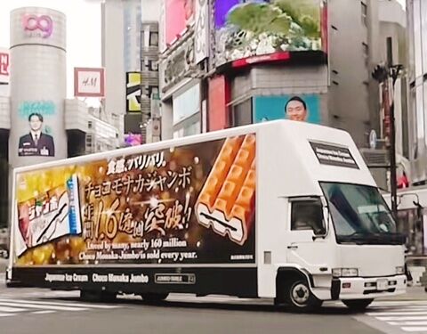 Promotional truck distributing free Choco Monaka Jumbo to tourists visiting Japan