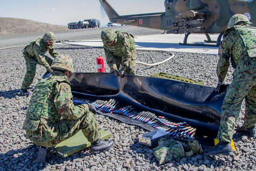 Japan_Defense_Force_members_prepare_ammo_for_Cobra