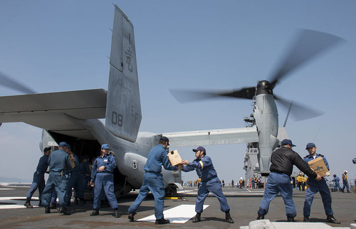 JMSDF_load_supplies_onto_an_MV-22B_Osprey_aircraft._