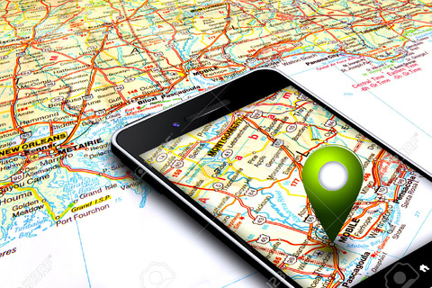 22685551-mobile-phone-with-gps-laying-on-map-Stock-Photo