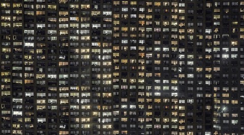 apartment-building-windows-glowing_925x