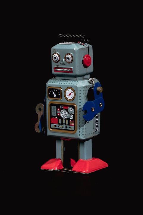 vintage-blue-robot-portrait-in-front-of-black-background_925x