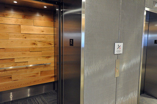elevator_door_open_to_show_wood_paneling_1397225315