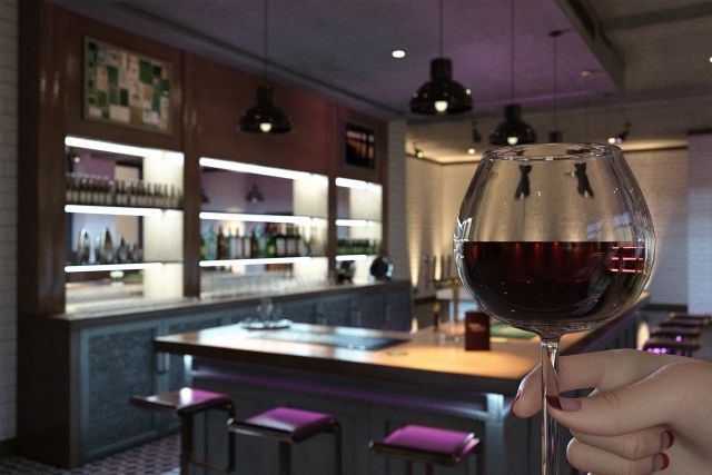 バー（お酒のワイングラスを持つ女性の手）