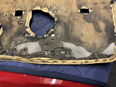 wk276_restore_door_inner_panel_R_board3_drilled_rivet_after