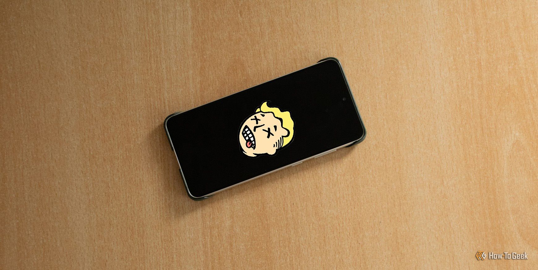 画面上に死んだ Vault Boy アイコンが表示された死んだ Samsung Galaxy S21 FE。