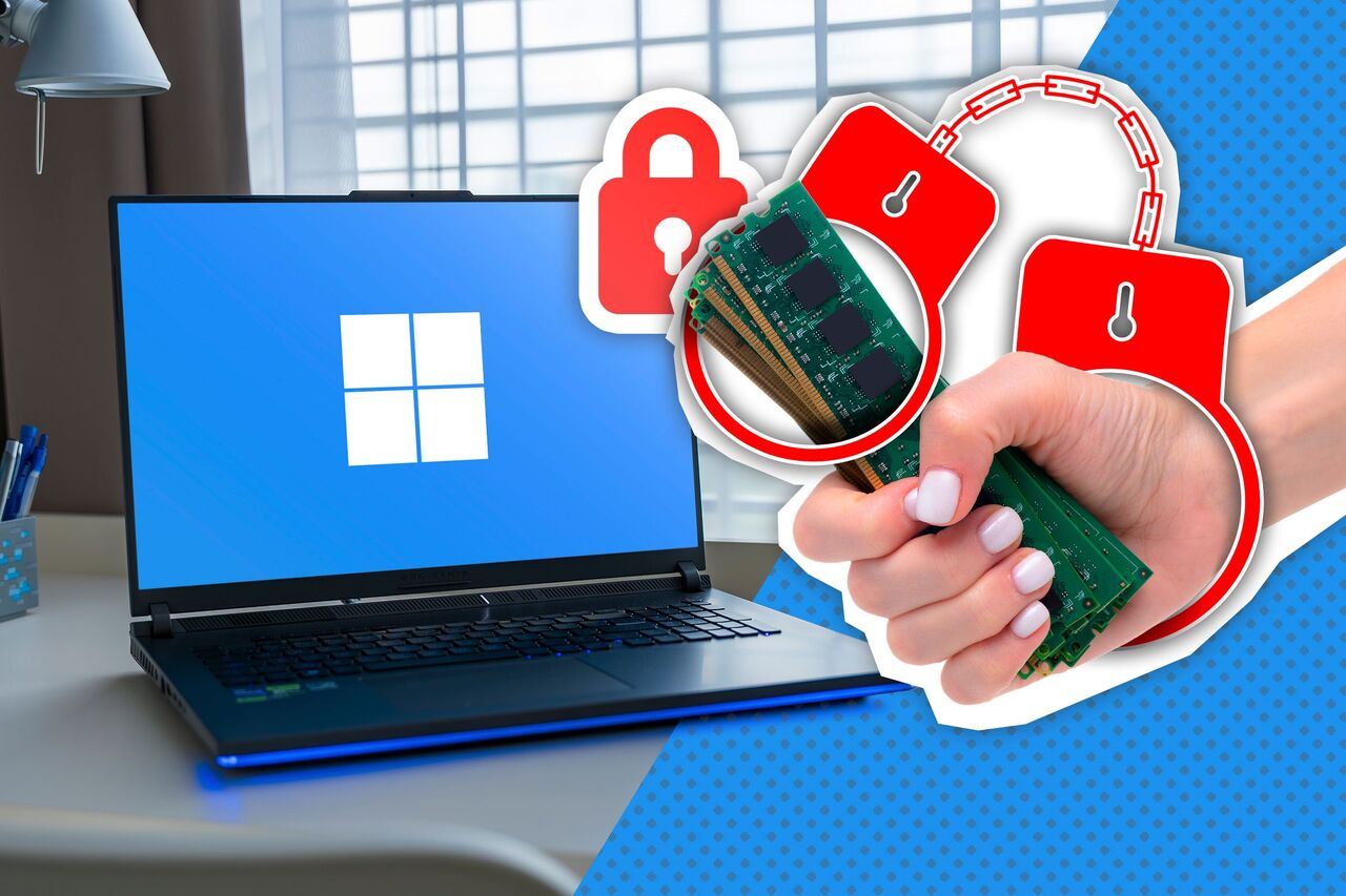 いくつかの RAM スティックと手錠を持つ手に Windows ラップトップ。