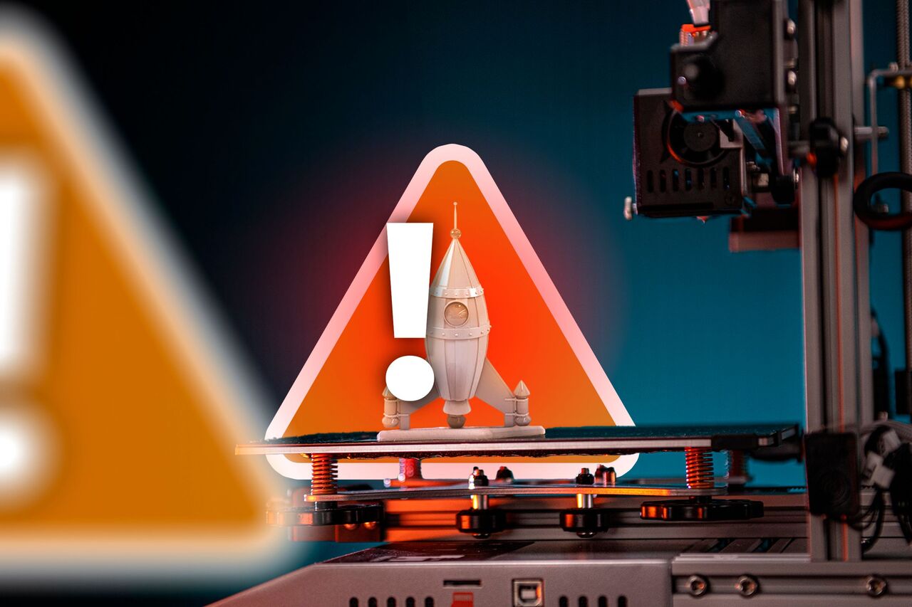 印刷物と警告サインを備えた 3D プリンター。