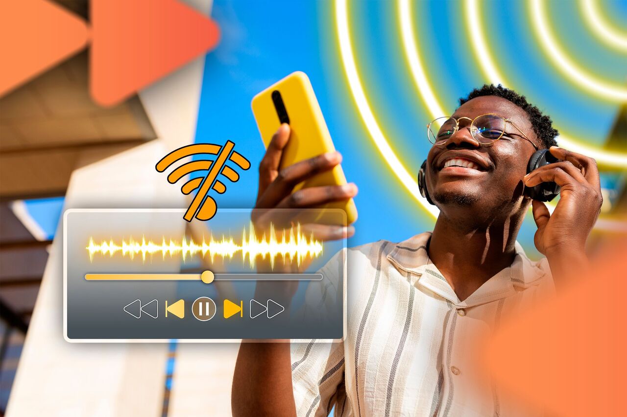 携帯電話のオフライン音楽プレーヤーで音楽を聴いている若い男性。