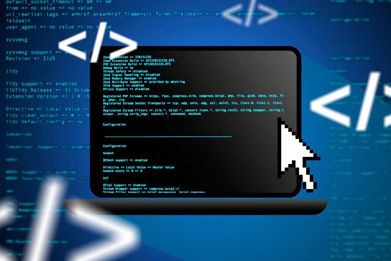 画面上にコードが表示され、マウス カーソルが表示されたラップトップ。