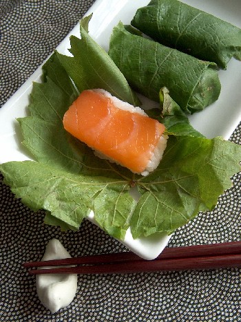 salmon sushi in vine leaves