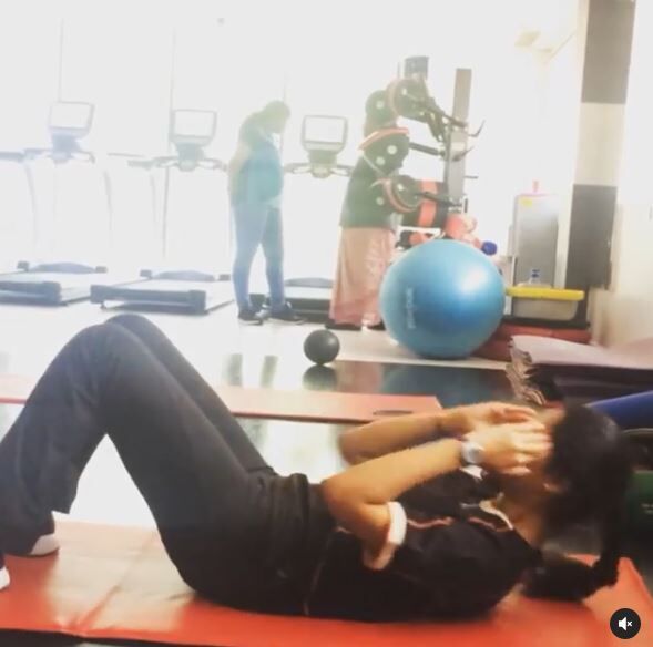 Tejaswini Vivek doing exercise at gym.