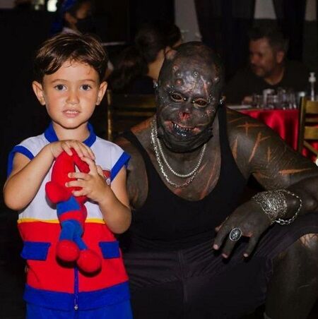 Michel Faro Do Prado with his grandson