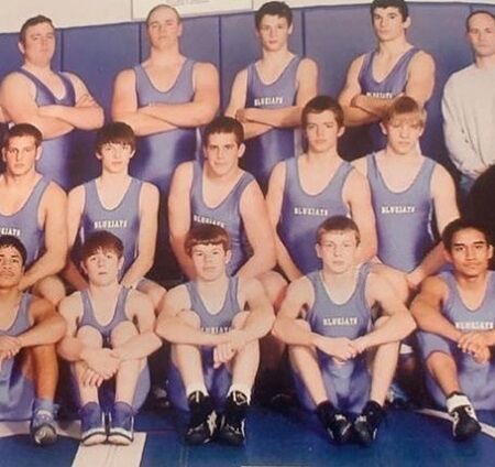Sam during his academic days learning Wrestling